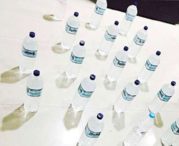 securitymen-seize-bottles-of-brew_kuwait