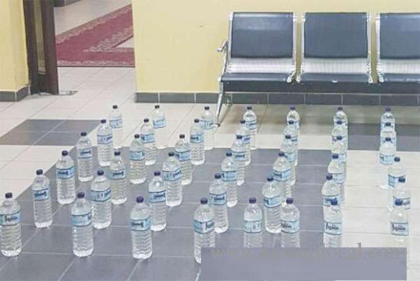 3-asian-expatriates-were-arrested-in-possession-of-48-bottles-of-locally-manufactured-liquor_kuwait